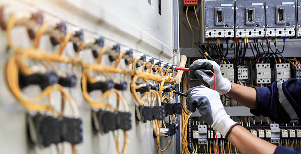 Professional Electrical Panel Upgrade technician working in Louisa County County, IA